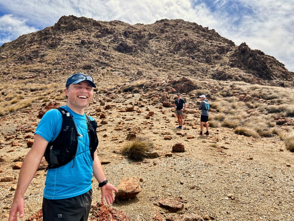 Brendyn with Dun Mountain behind him on a trail run.